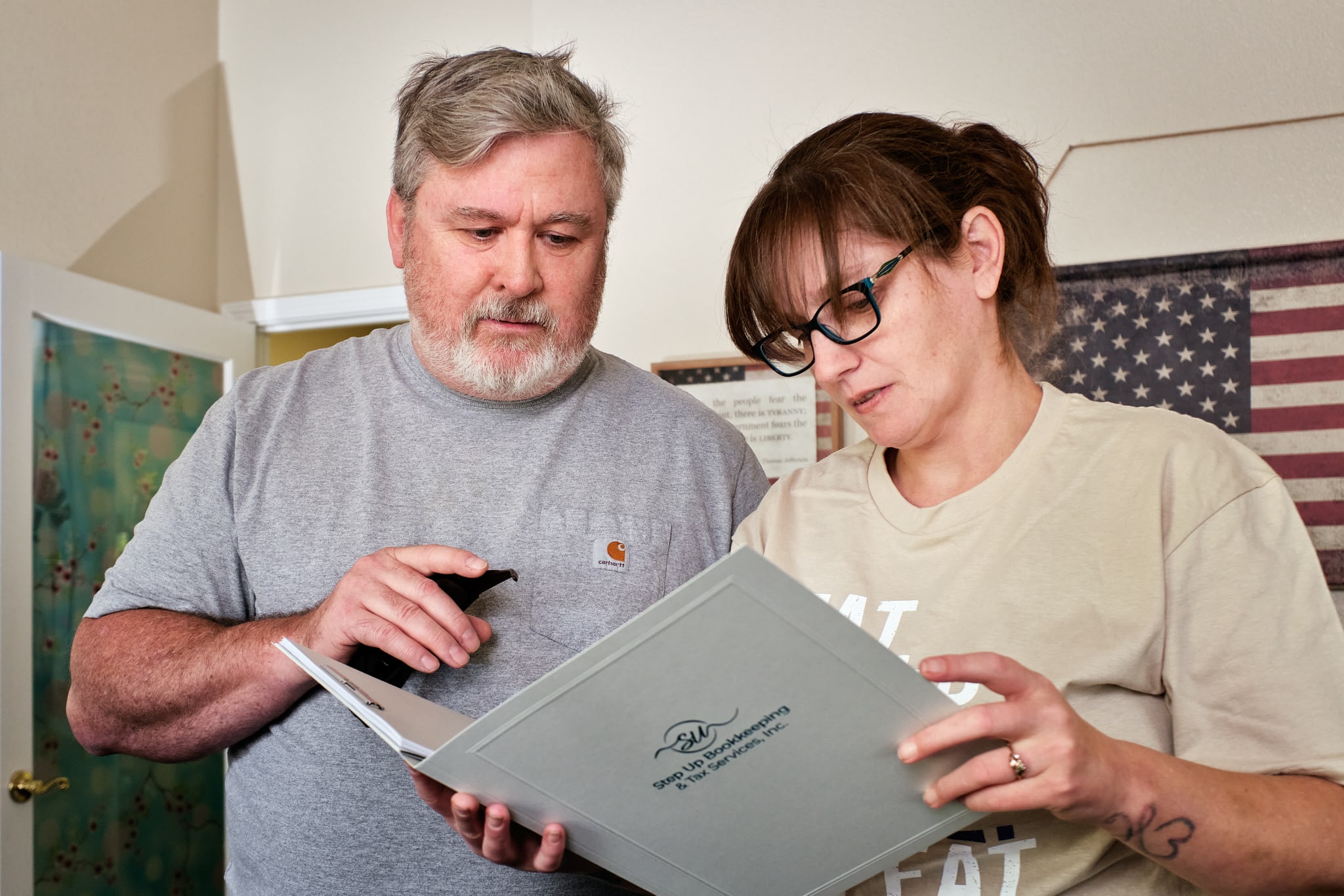 heather and richard looking at a folder