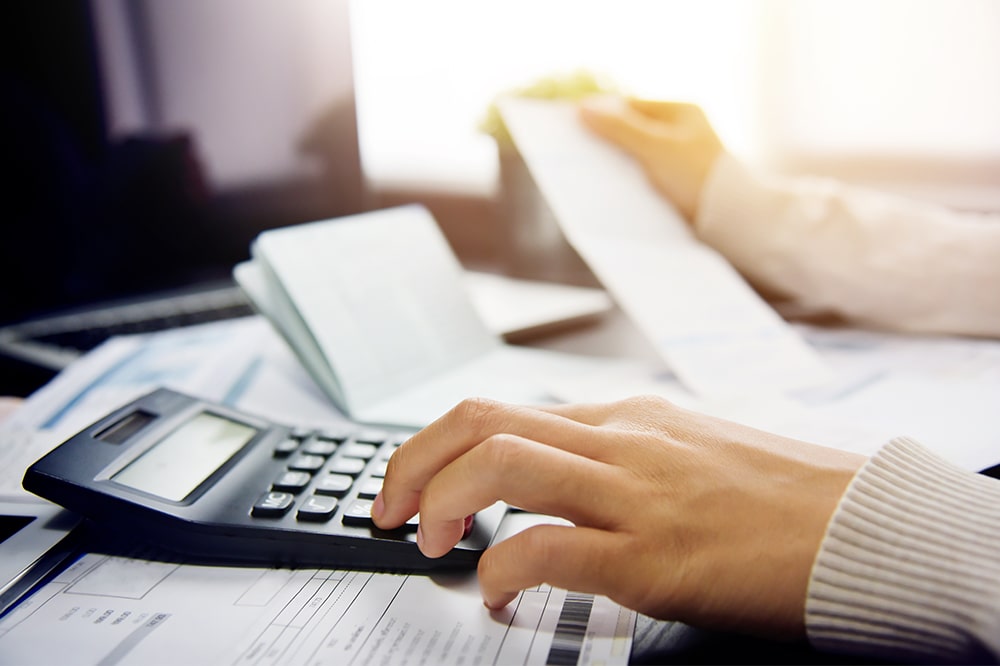 Karen in her office helping a woman with her taxes